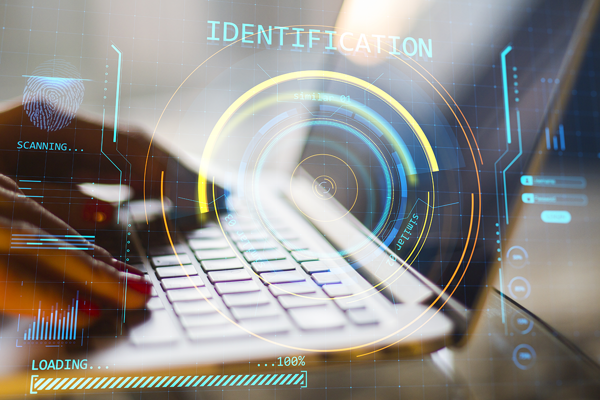 keyboard overlaid with futuristic identity verification graphics, including a fingerprint scan and progress indicators.